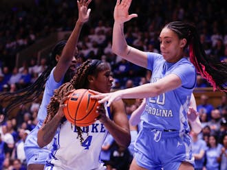 Elizabeth Balogun is defended in Duke women's basketball's Sunday loss to North Carolina.