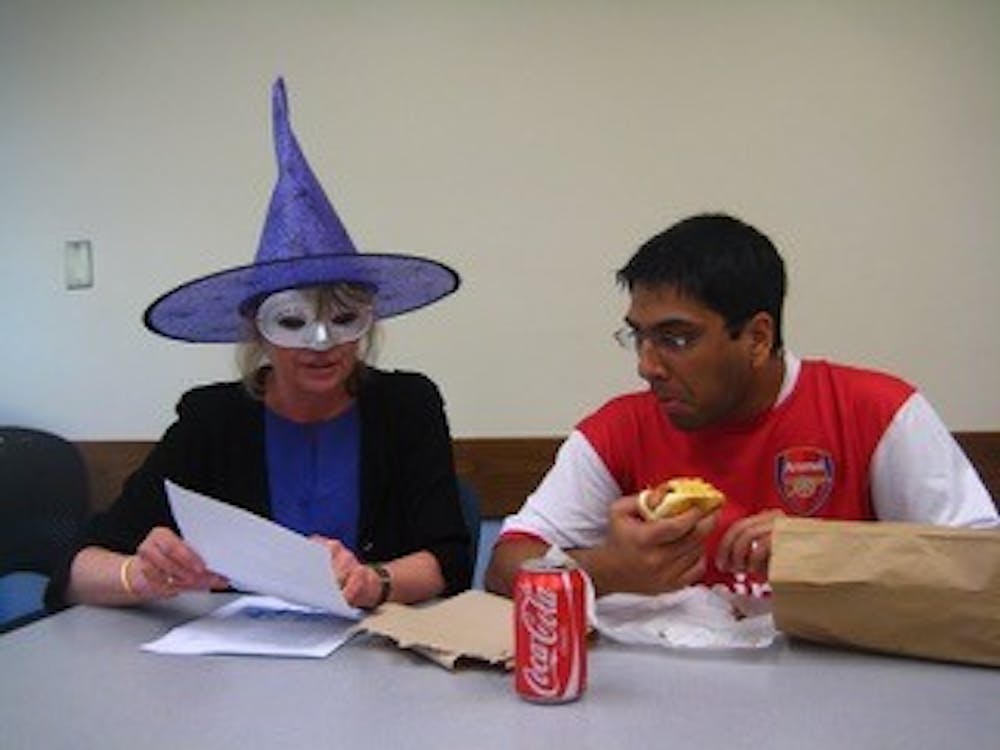 <p>Melissa Malouf loved this photo "because the student is so engaged despite [her] costume and his mouthful of food."&nbsp;</p>