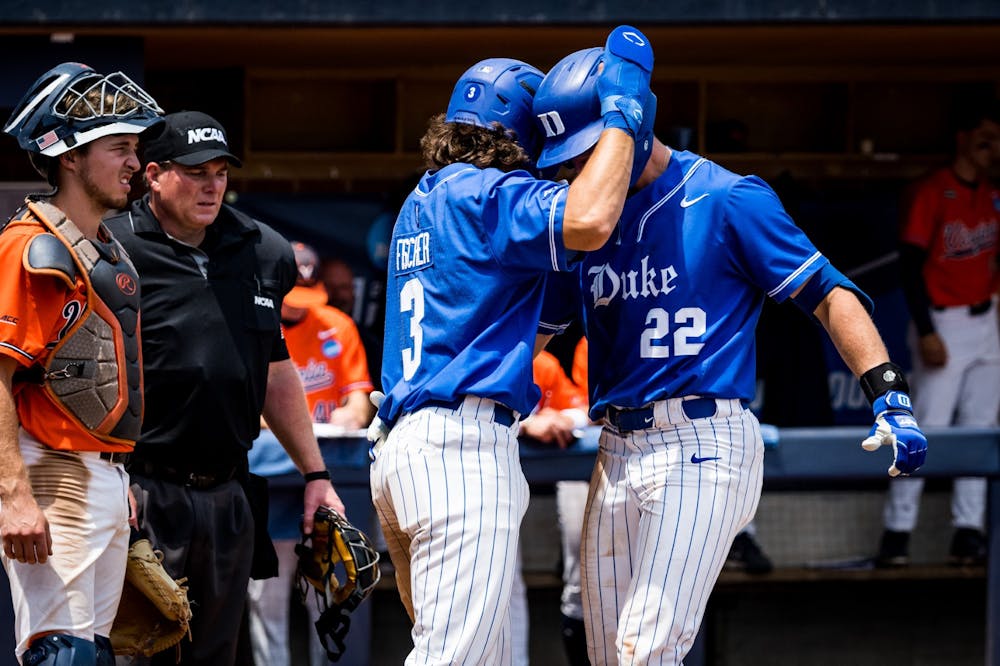 Andrew Fischer (3) and Jay Beshears (22) in Duke's Sunday loss to Virginia.