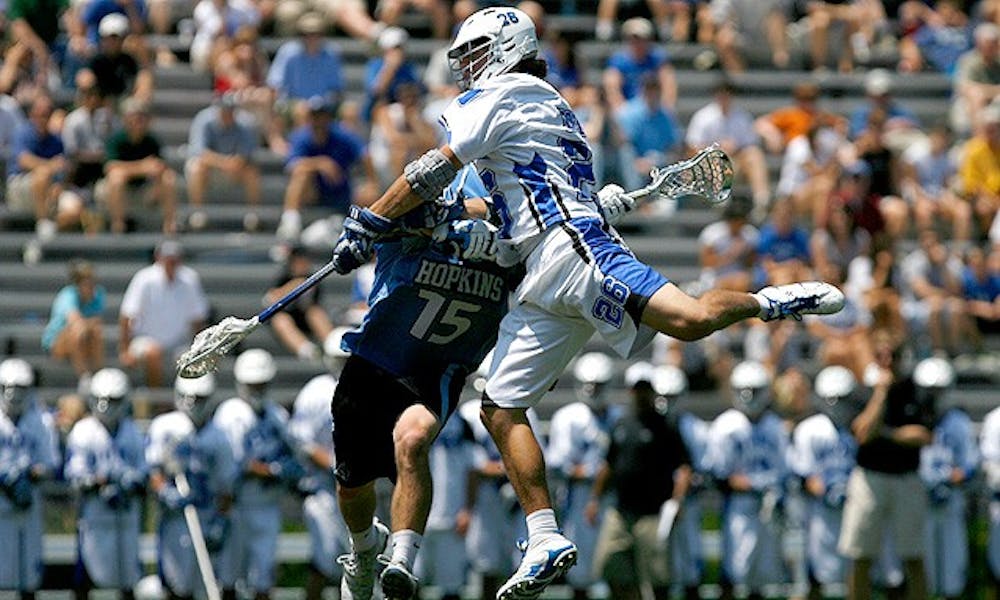 Sophomore Robert Rotanz, who had a goal and an assist in the game, flies over a Johns Hopkins defender.