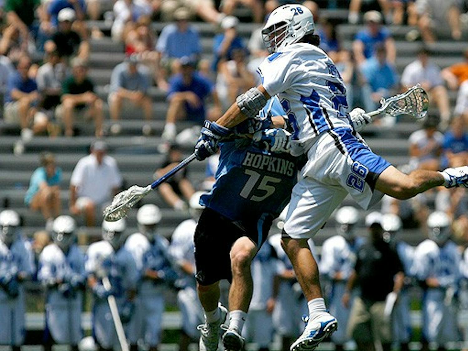 Sophomore Robert Rotanz, who had a goal and an assist in the game, flies over a Johns Hopkins defender.