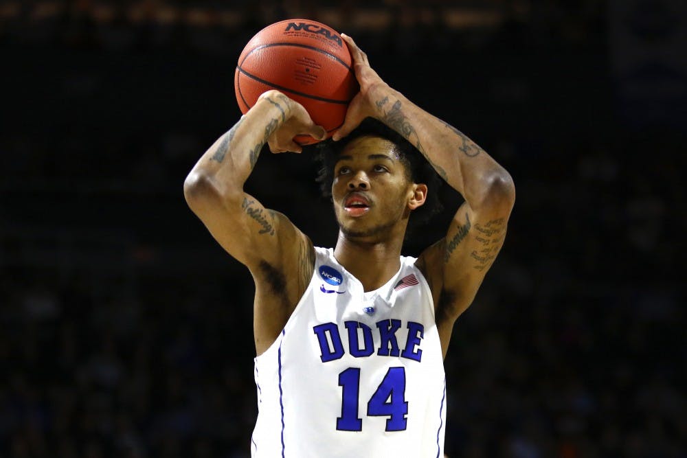 <p>Brandon Ingram kept the Bulldogs at bay with several timely baskets, and his two free throws in the final minute helped Duke ward off Yale's last-gasp comeback bid.</p>