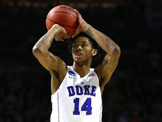 Brandon Ingram kept the Bulldogs at bay with several timely baskets, and his two free throws in the final minute helped Duke ward off Yale's last-gasp comeback bid.