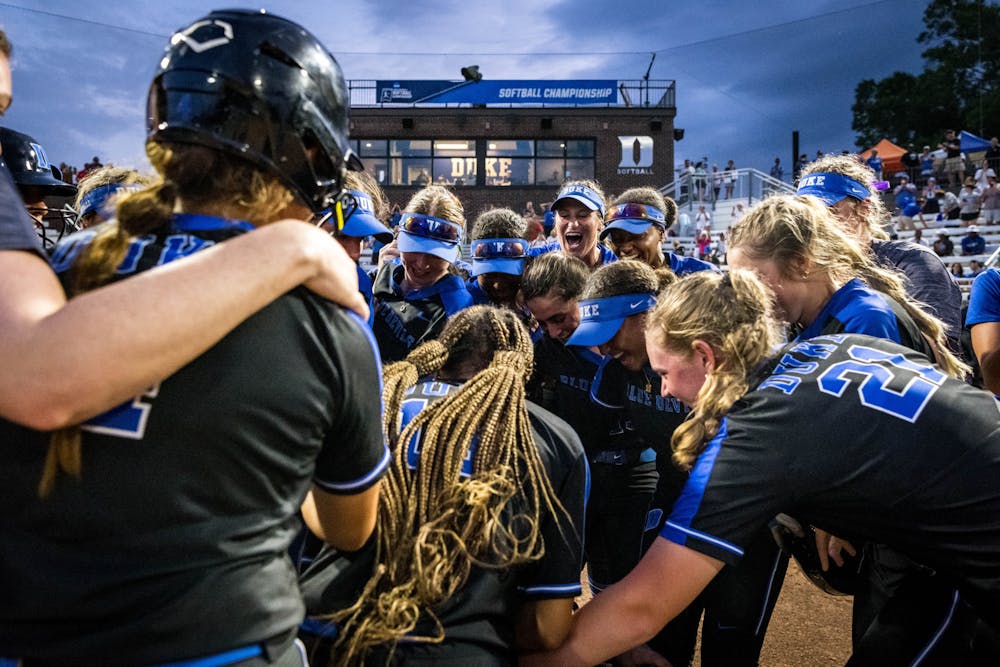 The Blue Devils celebrate after clinching a trip to the NCAA super regionals in May 2022 at Duke Softball Stadium.