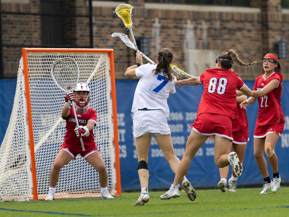 Senior midfielder Katie Keller takes a shot in Duke's game against Louisville.