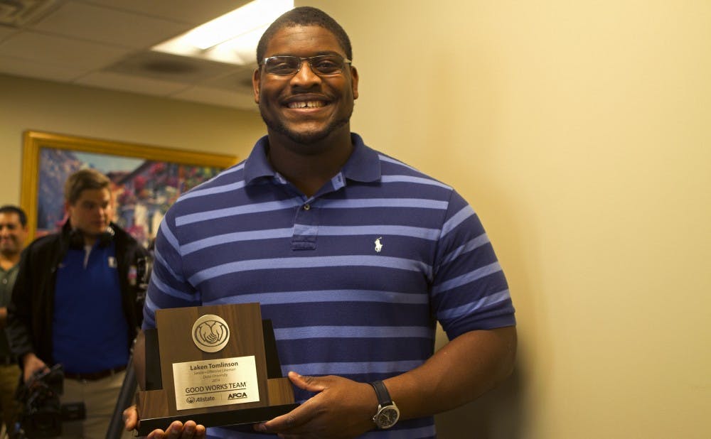 Redshirt senior Laken Tomlinson was recognized as a Allstate AFCA Good Works Team honoree Monday.
