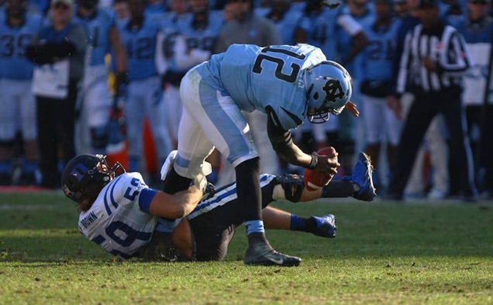 <p>Linebacker Kelby Brown suffered four knee injuries during his Blue Devil career but remained a critical part of the team by helping Duke's young linebackers break down film.</p>