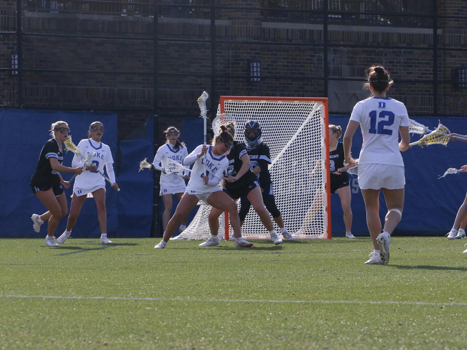 Senior attacker Katie DeSimone works against her defender in Saturday's hard-fought loss to Johns Hopkins. 