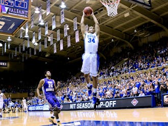 Graduate student Andre Dawkins, along with teammates Jabari Parker and Rodney Hood, gave the crowd at Cameron Indoor Stadium a healthy dose of slam dunks Tuesday.