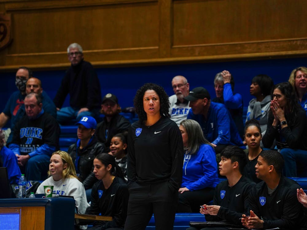 <p>Kara Lawson patrols the sidelines during Duke's home win Thursday evening against Pittsburgh.</p>