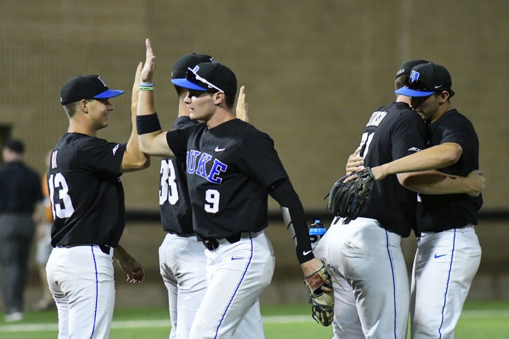Duke players celebrate and congratulate eacother after winning game 2 of the Lubbock super regional Texas Tech on Sunday, June 10, 2018, at Dan Law Field.  Duke won game 2, 11-2 to tie the series, 1-1.