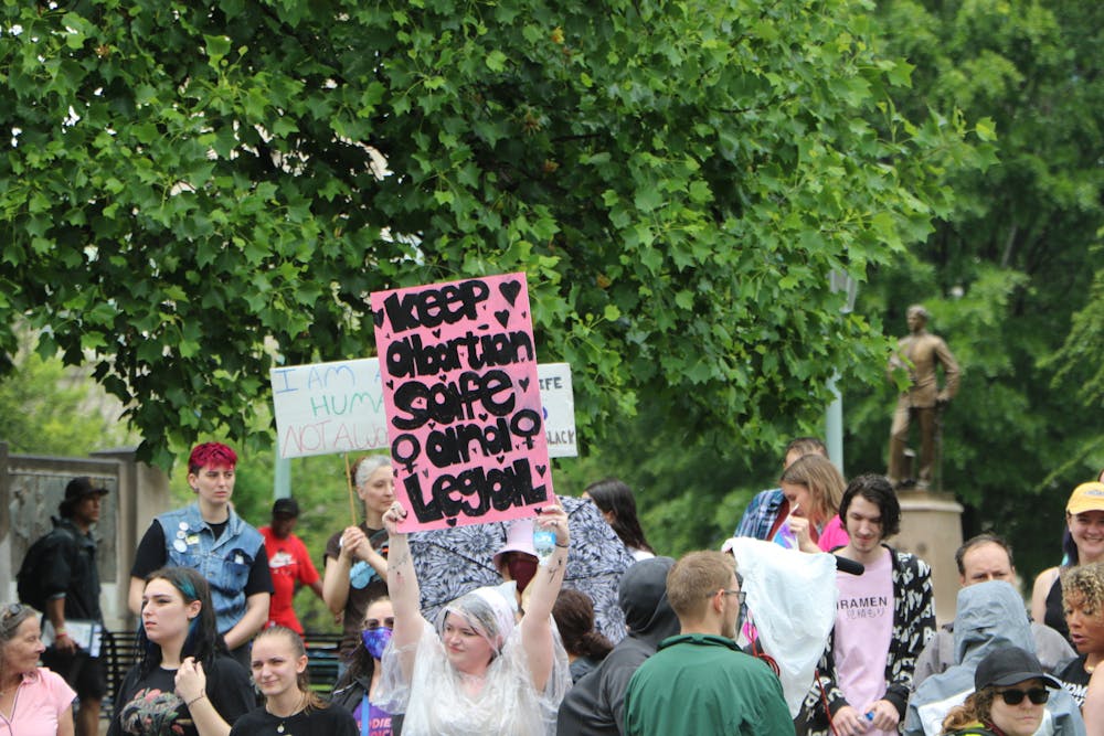 <p>Pro-choice protester holds sign that reads "keep abortion safe and legal."&nbsp;</p>