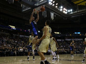 Center Marshall Plumlee dunked repeatedly in the second half en route to a career-best 18 points as the Blue Devils held off an upset-minded Wake Forest squad on the road Wednesday.