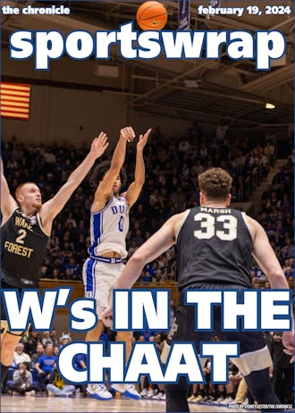 Jared McCain shoots over two defenders during Duke's win against Wake Forest.