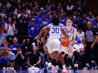 Shayeann Day-Wilson (middle) rushes to take the ball from Kennedy Brown (right) in Duke's loss to North Carolina Feb. 26.