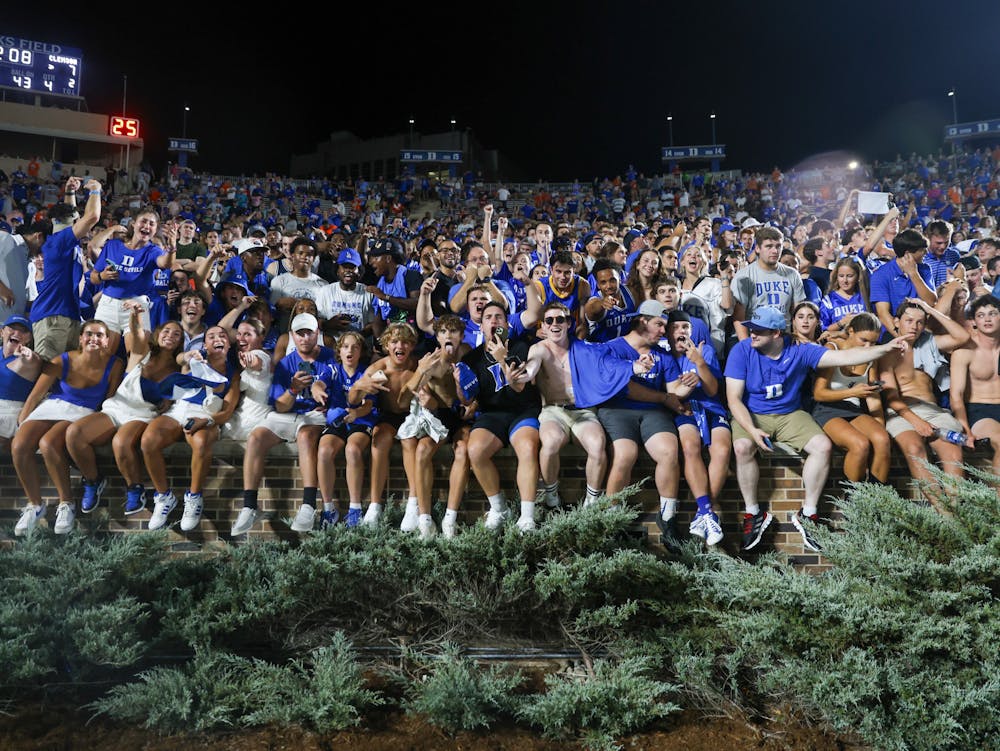 Duke students prepare to rush the field in the Blue Devils' Week 1 win against Clemson.