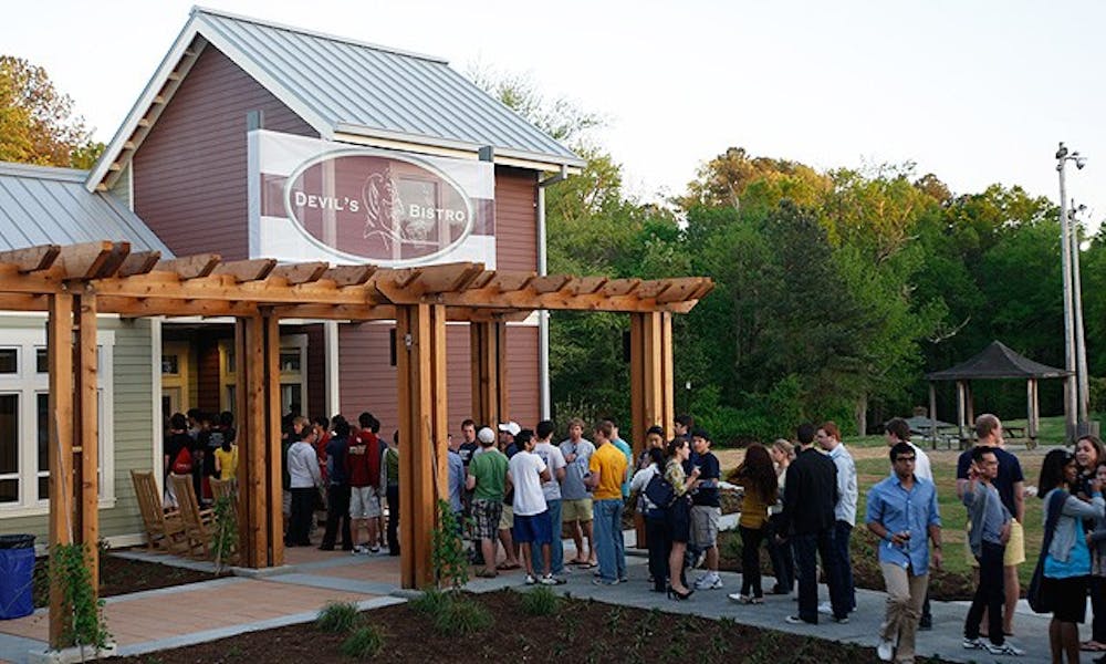 Students line up outside the Devil’s Bistro on Central Campus during Campus Council’s “Grand Central” party Friday evening.  The event celebrated the restaurant and Mill Village openings after months of delays.