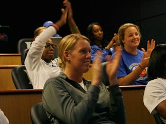 Kathleen Scheer and the rest of the Blue Devils celebrate the results of their NCAA Tournament seeding yesterday in the Krzyzewski Center.