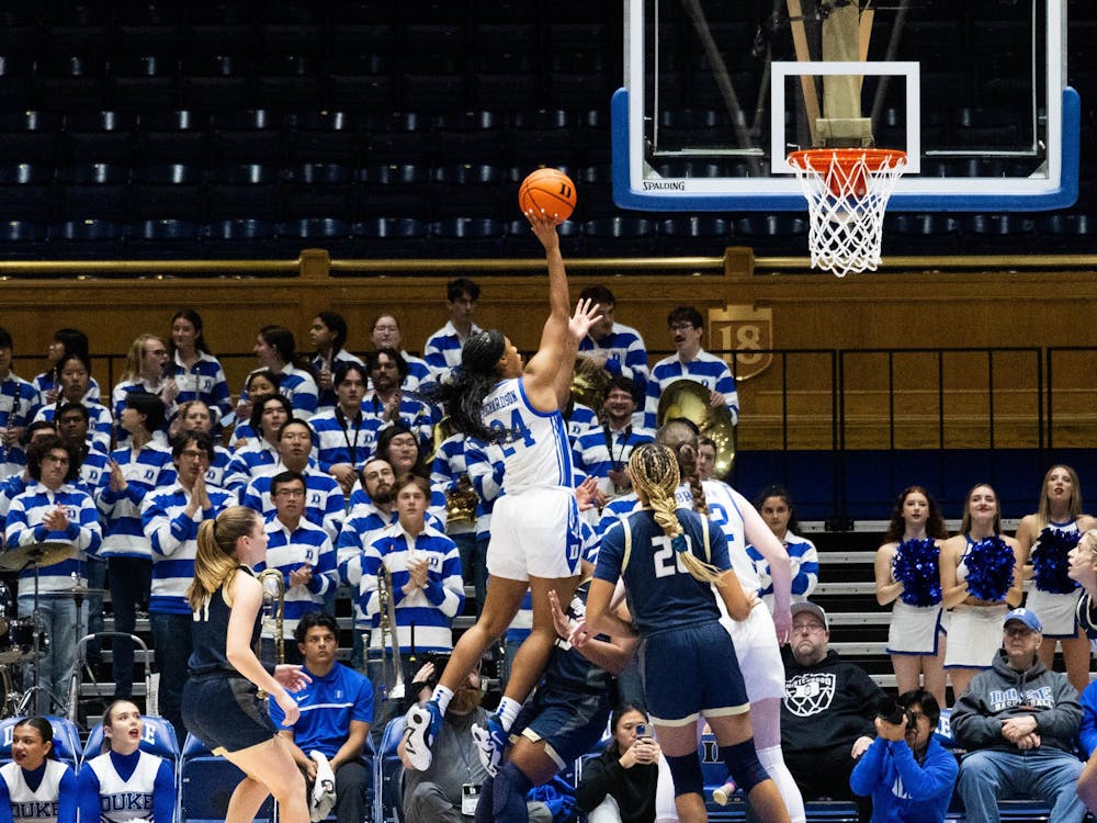 Reigan Richardson lofts the ball toward the net in Duke's exhibition win against Wingate.