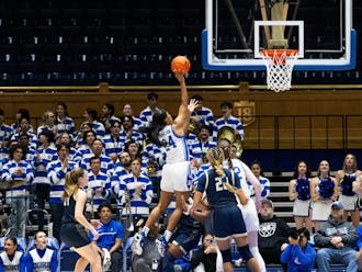 Reigan Richardson lofts the ball toward the net in Duke's exhibition win against Wingate.