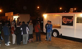 Bulkogi Korean BBQ truck and Parlez-Vous Crepe truck park in the Card Lot at midnight to serve hungry tenters in K-ville.