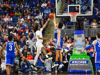 Dereck Lively II protects the rim in Duke's ACC tournament semifinal win against Miami. 