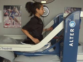 Senior cross-country runner Ashley Brasovan runs on the team’s new Alter G treadmill, purchased in April.