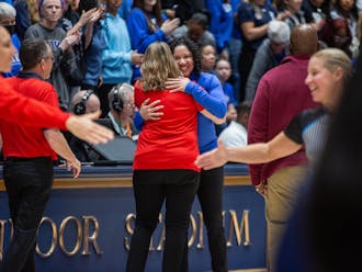 Kara Lawson shares an embrace with Cheryl Reeve, the National Team's head coach. 