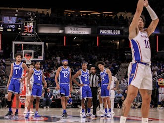 Duke watches on as Jalen Wilson shoots a technical free throw in the first half of Tuesday night's game.