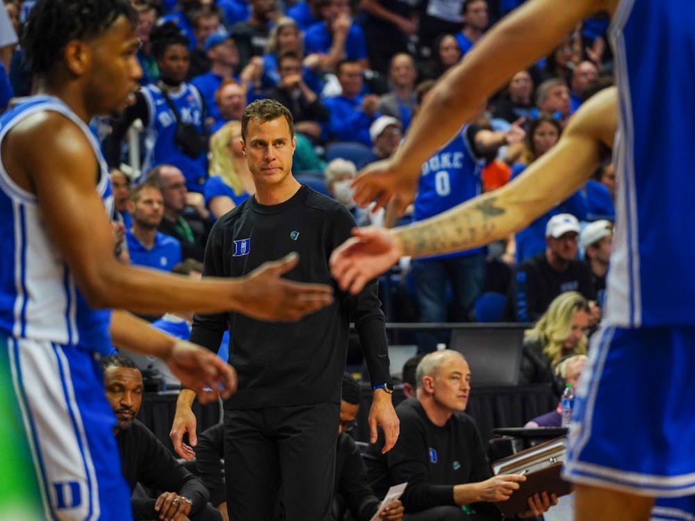 Head coach Jon Scheyer looks on from the sideline during the ACC championship game. He became the first coach to win the tournament as a player and head coach.