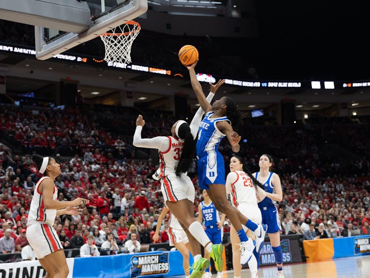 Jadyn Donovan rises above Ohio State defenders for a layup.