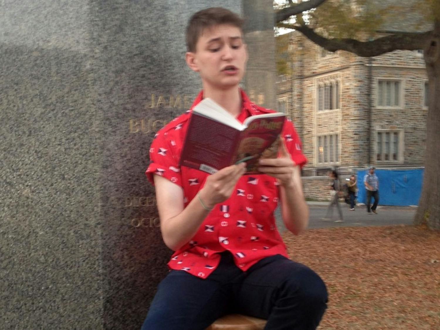 Senior Robbie Florian sits on the Chapel Quad every day at 4 p.m. and reads from the Harry Potter series.