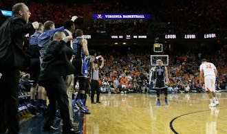 Freshman Tyus Jones put the dagger in Virginia's undefeated campaign with a 3-pointer with only 10.4 seconds remaining.