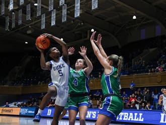 Oluchi Okananwa fights for a shot under double coverage against Florida Gulf Coast.