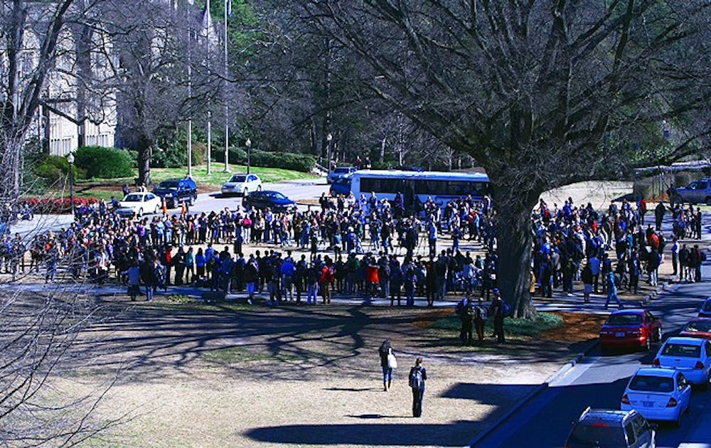 Organized via Facebook, hundreds of Duke students gathered at the West Campus bus stop for a demonstration protesting Kappa Sigma’s controversial Asian party theme.