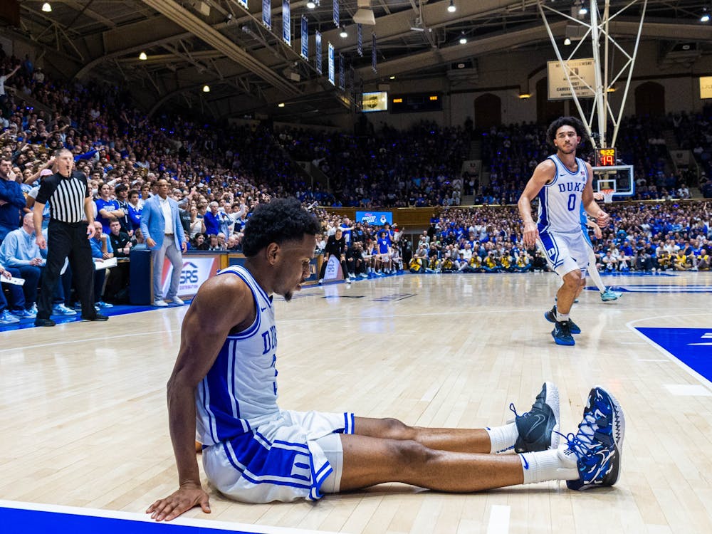 Jeremy Roach sits dejected during Duke's Saturday night loss to North Carolina.