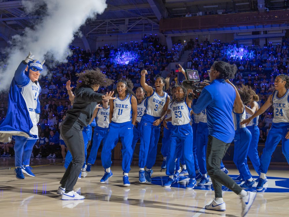 Duke women's basketball dancing with head coach Kara Lawson at 2024 Countdown to Craziness.