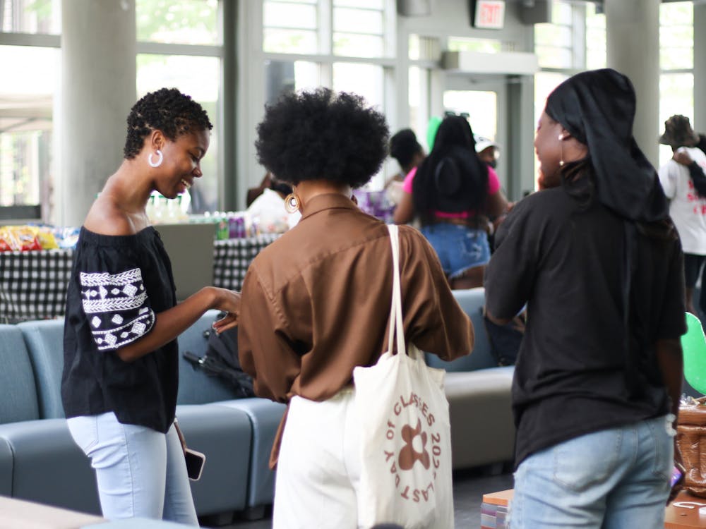 <p>A group of women chat at the Duke Black Student Alliance's afternoon cookout.</p>