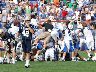 Duke players rejoice their win in front of the goal where Costabile scored to clinch the team&amp;amp;#039;s first-ever national championship.