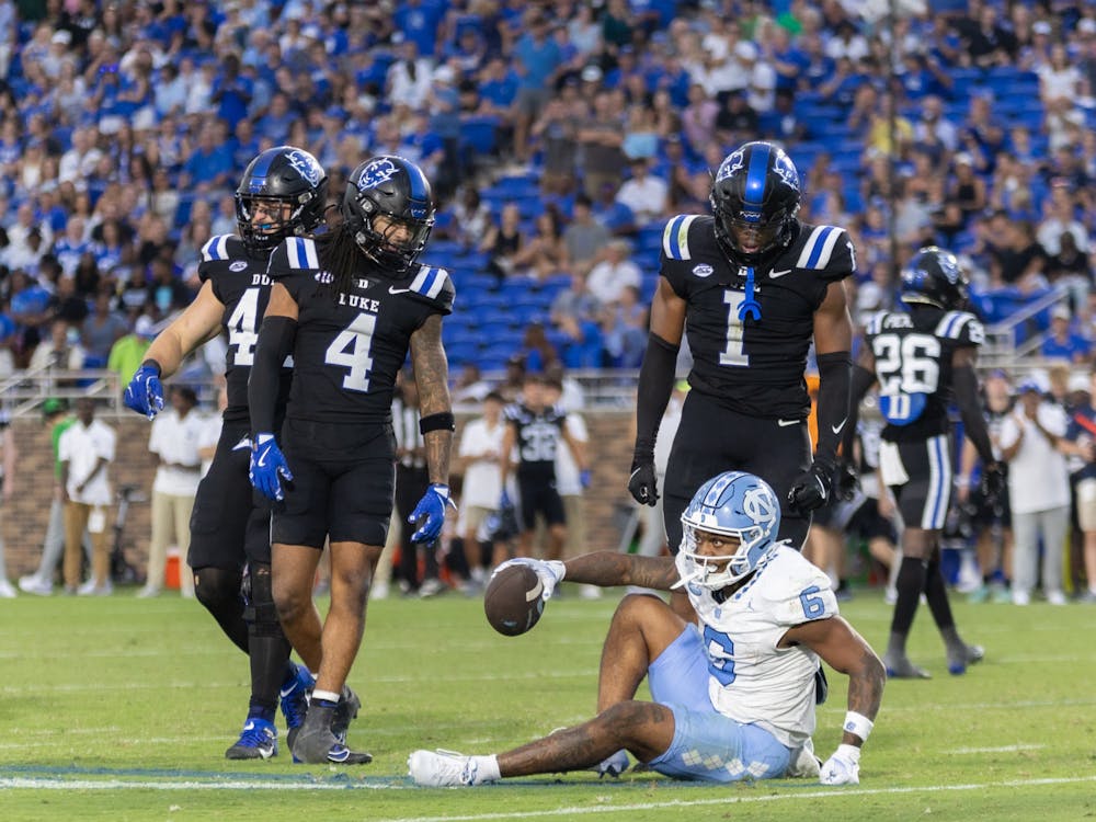 Terry Moore (right) has been the anchor of the Blue Devil secondary. 