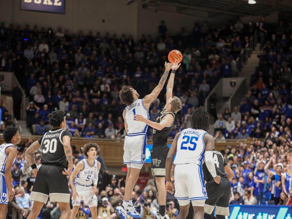 Duke freshman Dereck Lively II leaps for the opening tipoff.