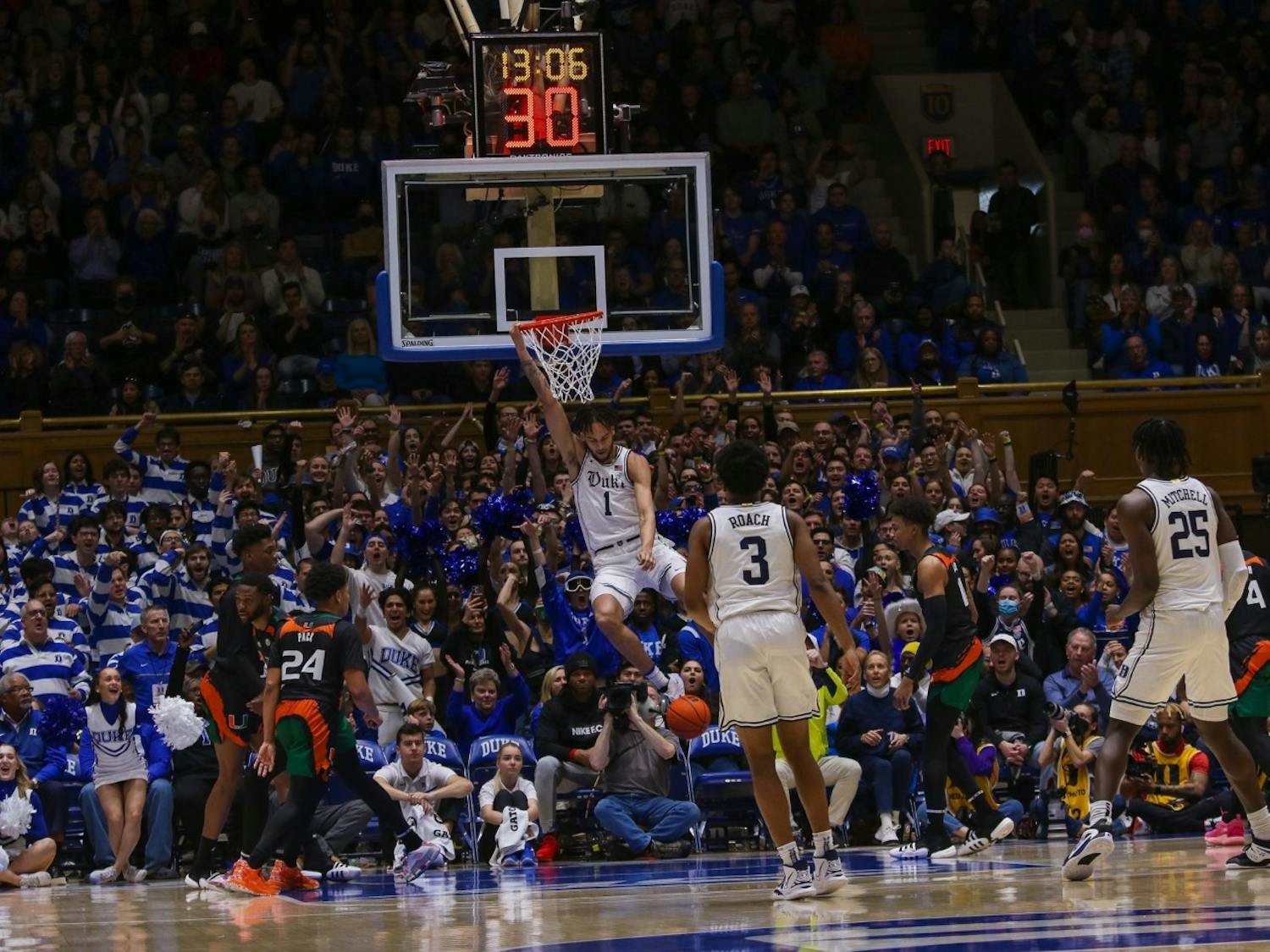 Dereck Lively II hangs from the rim after a dunk against Miami.