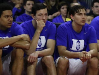 Freshman walk-on Brennan Besser (center) considered playing at Yale but could not pass up the opportunity to be a Blue Devil, even if it meant a smaller role.