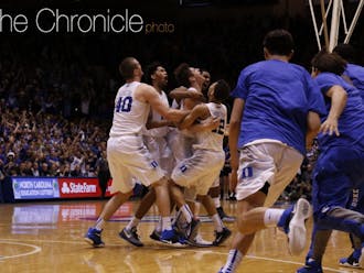The Blue Devils piled on Allen after his buzzer-beating runner, giving Duke its second straight win against a ranked opponent.