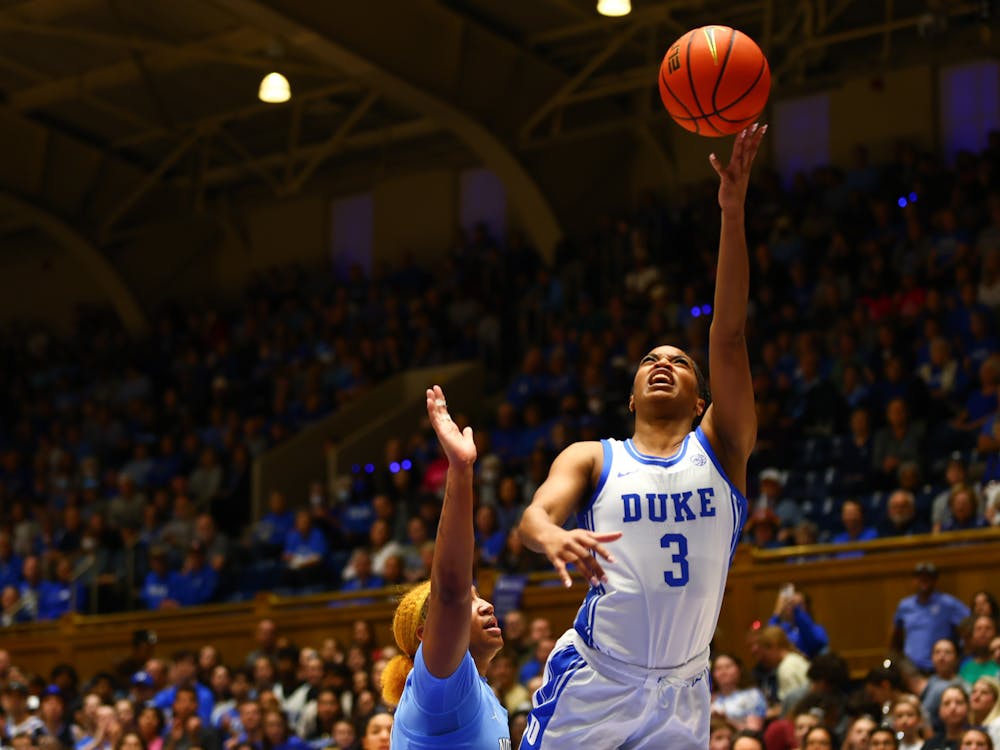 Ashlon Jackson extends an arm to loft the ball in during Duke's first half against North Carolina.