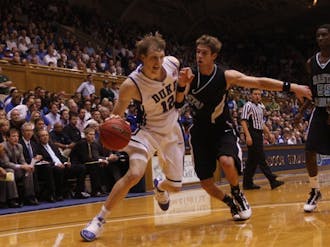 Junior Kyle Singler’s 23 points and 11 rebounds helped Duke overcome a slow start in a 74-49 victory over Coastal Carolina in the first round of the NIT Season Tip-Off. Singler scored 15 of his 23 in the first half.