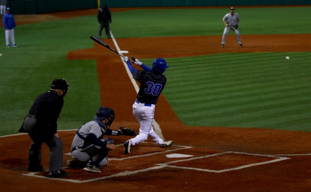 Center fielder Jimmy Herron hit two doubles as the Blue Devils came from behind to defeat UNC Greensboro 7-4.