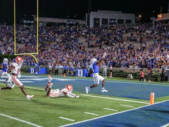 Running back Jordan Waters charges into the end zone to seal Duke's victory against Clemson.