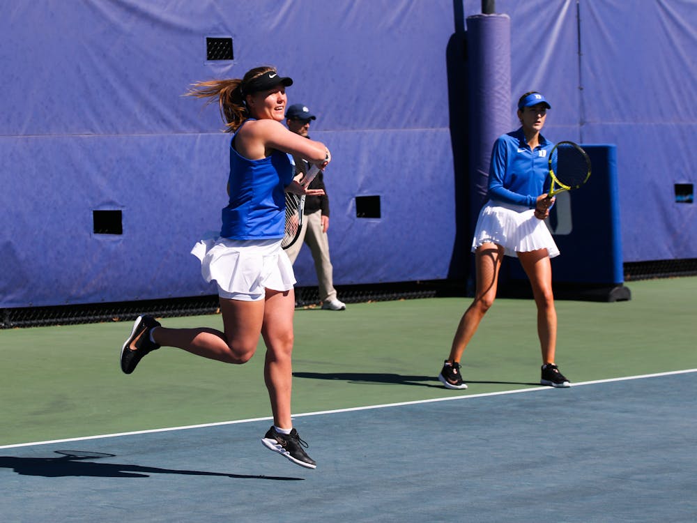 Iuliia Bryzgalova (left) and Georgia Drummy (right) in the duo's 6-1 win Sunday against Louisville.