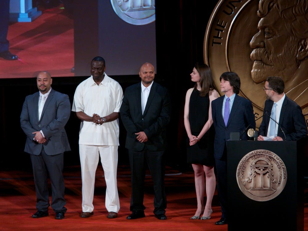 <p>Members of the Exonerated Five with Ken Burns after the 2012 documentary about their case. Raymond Santana (left) and Yusef Salaam (second-from-left) are speaking at Duke next week.</p>